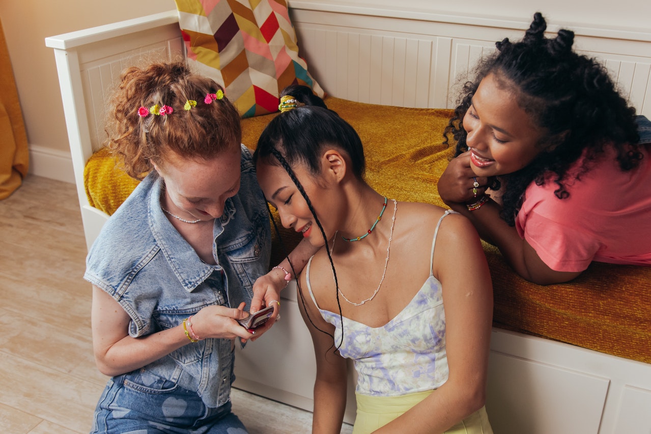 Women Looking at the Screen of a Cellphone