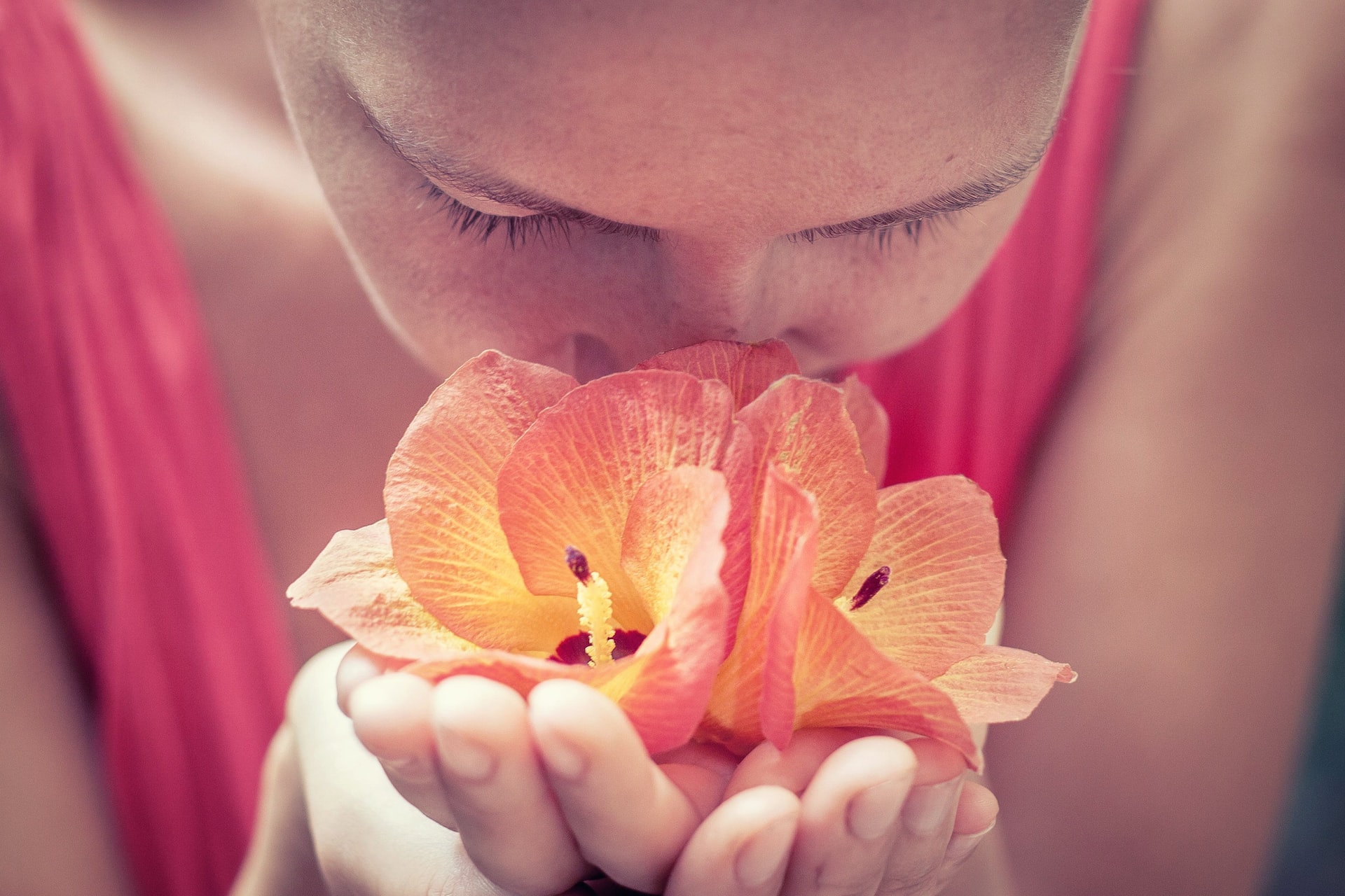 Woman smelling flowers