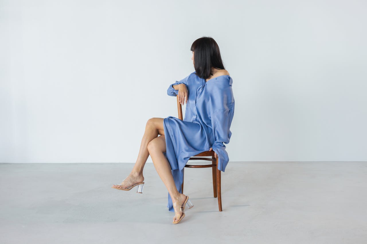 woman wearing transparent heeled open back sandals