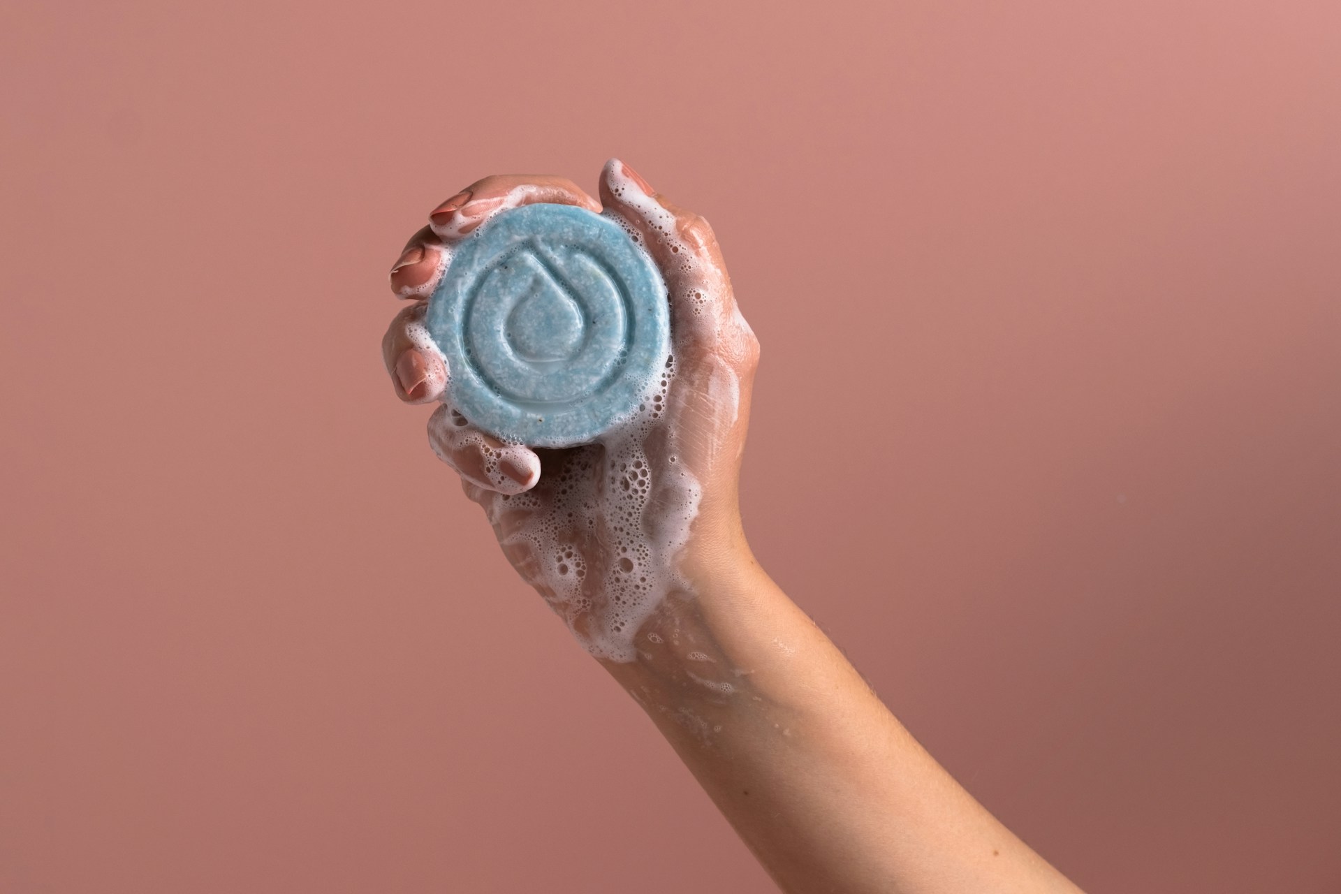 woman holding a Sustainable soap bar