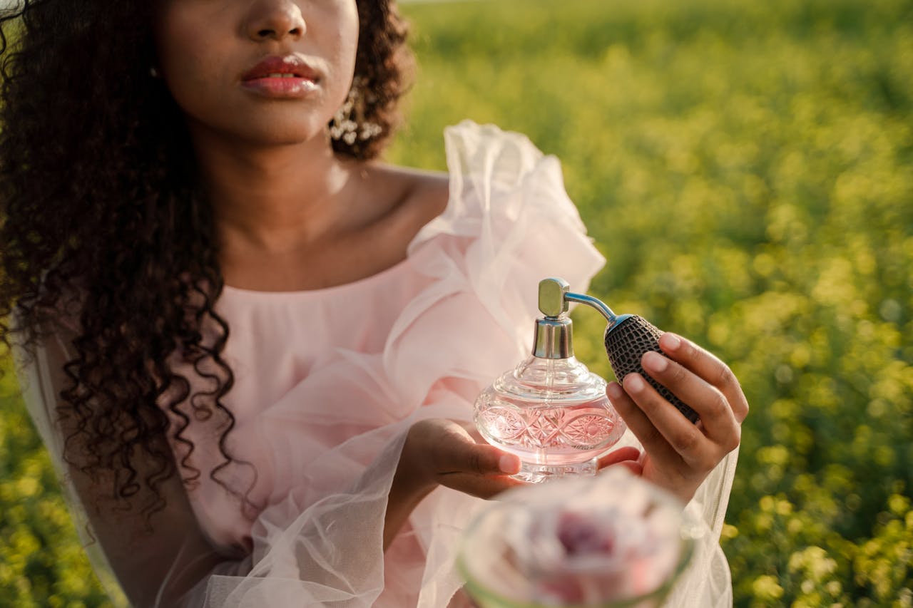 Woman holding a perfume bottle