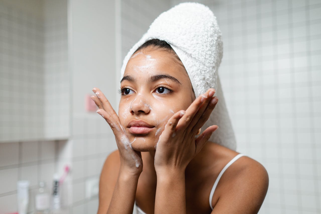 Woman cleansing her skin